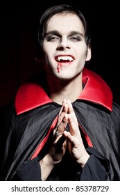 Male Vampire Smiling Dangerously