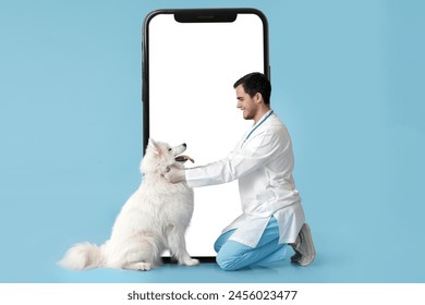 Male veterinarian with Samoyed dog and big smartphone on light blue background - Powered by Shutterstock