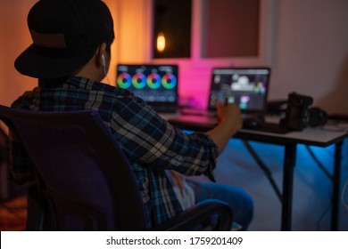 Male video editor works with color grading and color correction this is a lifestyle of a freelance content creator - Shutterstock ID 1759201409