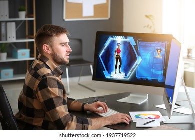 Male video games designer working in studio