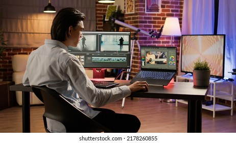 Male videographer editing footage with visual effects software, creating content and designing video montage with color gradient. Multimedia film production on computer. . - Shutterstock ID 2178260855