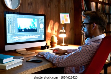 Male Videographer Editor Film Maker Using Pc Computer Editing Video Footage Visual Content Working On Pc At Home Office Using Post Production Video Editing Multimedia Montage Digital Software Concept.