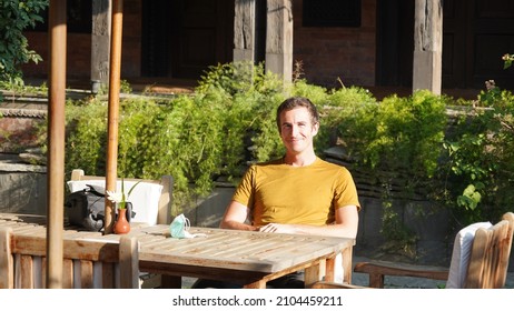 Male waiting for his breakfast on a sunny morning in a hotel in Kathmandu, Nepal.