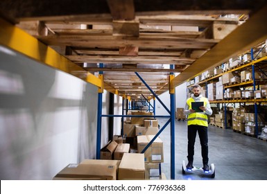 Male warehouse worker on hoverboard. - Powered by Shutterstock