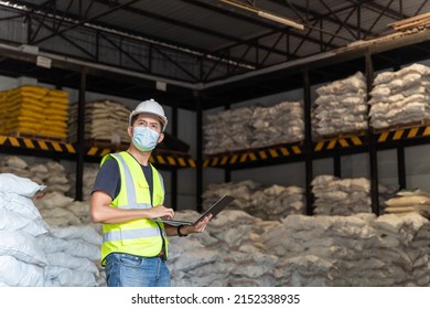 A Male Warehouse Worker Portrait With Laptop In Alum Or Chemical Warehouse Storage. International Export Business Concept.