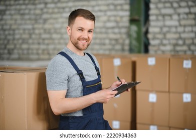 Male warehouse worker portrait in warehouse storage - Shutterstock ID 2220934363