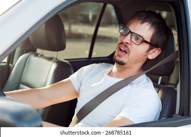 Male white driver is scared in traffic accident