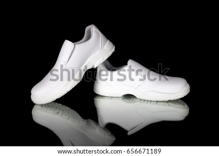Male White Safety Shoe on Black Background, Isolated Product, Top View, Studio.