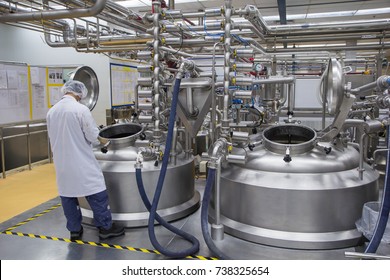 Male Work The Process Of Cream Cosmetic Fermentation At The Manufacturing With Stainless Tank On The Background