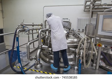 Male  Work The Process Of Cream Cosmetic Fermentation At The Manufacturing With Stainless Tank On The Background