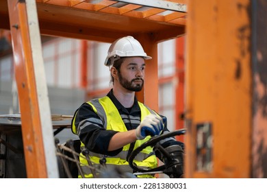 Male worker driving a forklift in factory - Powered by Shutterstock