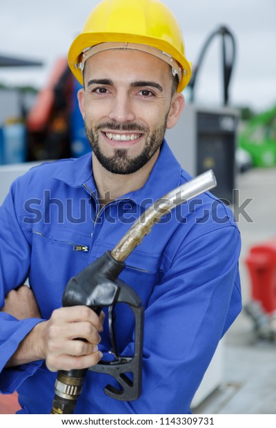 male worker at gas\
station