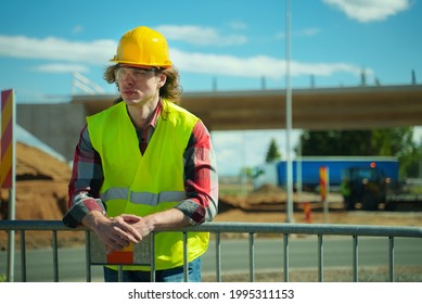 Male Worker In Hardhat And High Vis Jacket.