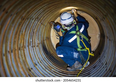 Male Worker Inspection Measured The Coil Pipe Circular Thickness Of The Boiler Scan Minimum Thickness Into Danger Confined Space.