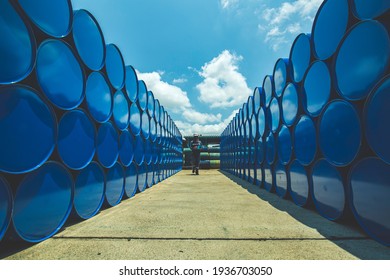 Male worker inspection record drum oil stock barrels blue horizontal or chemical for in industry