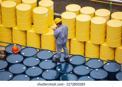 Male Worker Inspection Record Drum Oil Stock Barrels Yellow Vertical Or Chemical For Transportation Truck Male In The Industry.