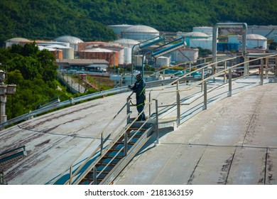 Male Worker Are For Inspection Roof Plate Dome Top Of Storage Tank.