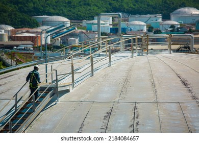 Male Worker Are For Inspection Roof Plate Dome Top Of Storage Tank.