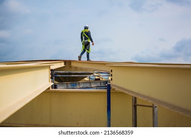 Male Worker Inspection Safety First Harness And Safety Lone Working At High Beam Tank Roof Oil Industry.