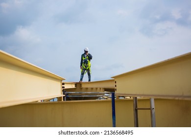 Male Worker Inspection Safety First Harness And Safety Lone Working At High Beam Tank Roof Oil Industry.