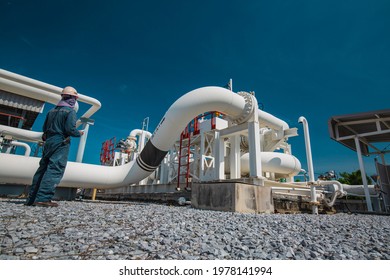 Male Worker Inspection At Steel Long Pipes And Pipe Elbow In Station Oil Factory During Refinery Valve Of Visual Check Record Pipeline Oil And Gas Industry