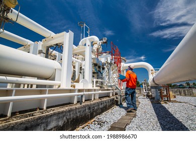 Male worker inspection at steel long pipes and pipe elbow in station oil factory during refinery valve of visual check record pipeline oil and gas industry