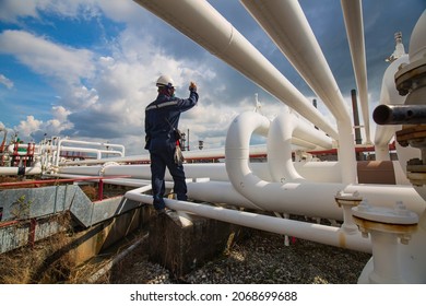 Male Worker Inspection At Steel Long Pipes And Pipe Elbow In Station Oil Factory During Refinery Valve Of Visual Check Record Pipeline Oil And Gas Industry.