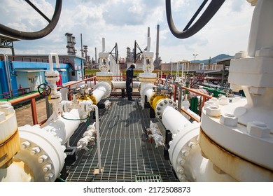 Male Worker Inspection At Steel Long Pipes And Pipe Elbow In Station Oil Factory During Refinery Valve Of Visual Check Record Pipeline Oil And Gas Industry.