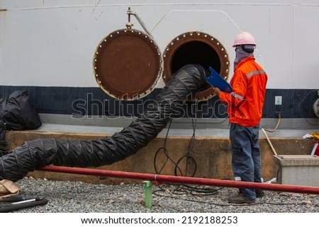 Male worker inspection the tank carbon chemical oil interface area confined space safety.