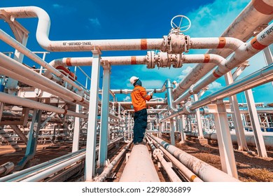 Male worker inspection at valve of visual check record pipeline oil and gas industry