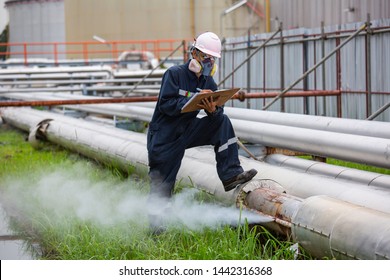 Male worker inspection visual pipeline oil and gas corrosion rust through socket tube steam gas leak pipeline at insulation.