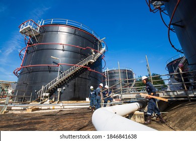 Male worker inspection visual pipeline and storage tank crude oil