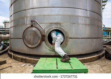 Male Worker Into  Manhole Fuel Tank Oil Chemical Protective Clothing Area Confined Space Dangerous