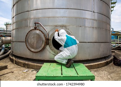 Male Worker Into  Manhole Fuel Tank Oil Chemical Protective Clothing Area Confined Space Dangerous