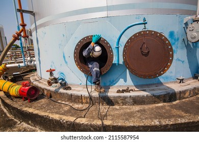 Male Worker Into The Tank Carbon Chemical Oil Interface Area Confined Space Safety.