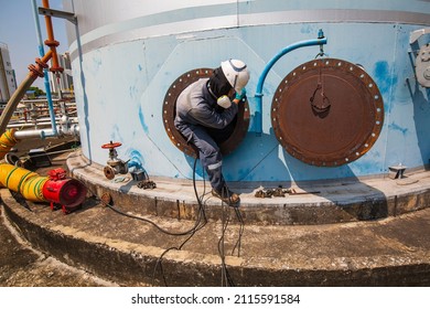 Male Worker Into The Tank Carbon Chemical Oil Interface Area Confined Space Safety.