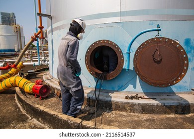 Male Worker Into The Tank Carbon Chemical Oil Interface Area Confined Space Safety.