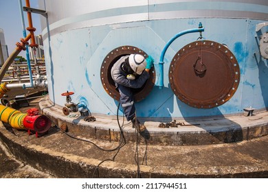 Male Worker Into The Tank Carbon Chemical Oil Interface Area Confined Space Safety.