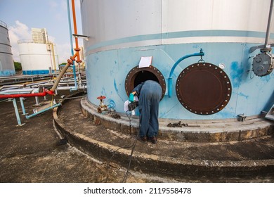 Male Worker Into The Tank Carbon Chemical Oil Interface Area Confined Space Safety.