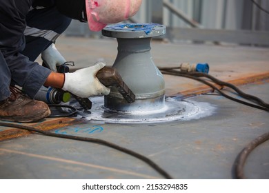 Male worker test nozzle tank butt weld carbon roof plate of storage tank oil background white contrast of magnetic field test - Shutterstock ID 2153294835