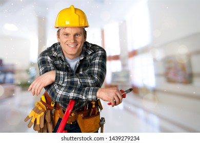 Male worker with tool belt isolated on   background - Shutterstock ID 1439279234