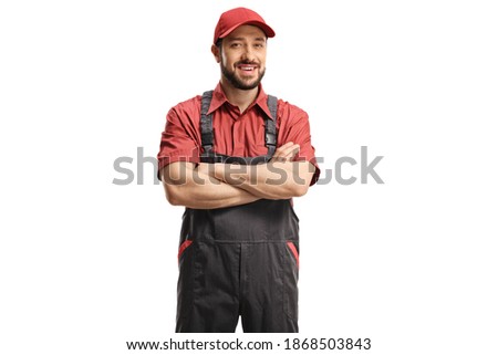 Male worker in a uniform posing with crossed arms isolated on white background