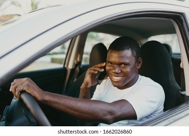 male young african american in car in white t-shirt - Shutterstock ID 1662026860