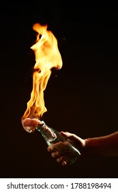 Male's hand with a burning Molotov cocktail isolated on black background. Concept photography about protests and war - Shutterstock ID 1788198494