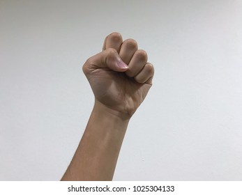 Males hand with a clenched fist isolated on a white background - Shutterstock ID 1025304133