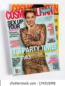 MALESICE, CZECH REPUBLIC - JANUARY 31, 2014: stack of US edition of magazine Cosmopolitan, on top issue December 2013 with Miley Cyrus on cover, on display in Malesice, Czech republic in January 2014