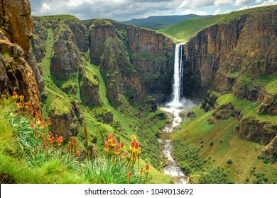 Maletsunyane Falls in Lesotho Africa. Most beautiful waterfall in the world. Green scenic landscape of amazing water fall dropping into a river inside canyons. Panoramic views over the great falls. - Powered by Shutterstock