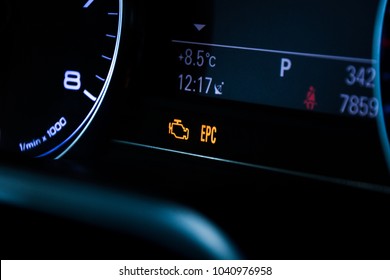 Malfunction or check engine car symbol, dash board close up