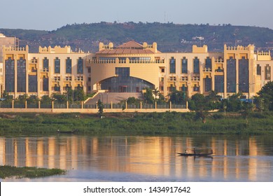 Mali, Bamako – July 08, 2018: Zoomed Niger river view onto Cite Administrative De Bamako building.