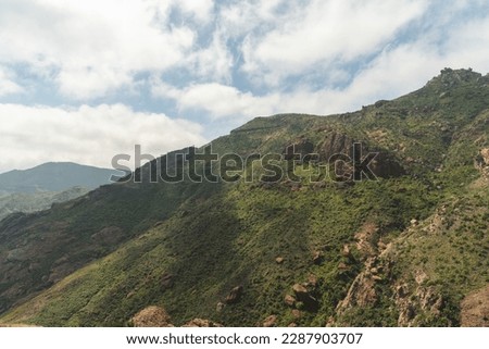 Malibu California Mountain Hiking Mishe Mokwa Trail With Green Hillside, Blue Sky With Clouds In A Nature Idealistic Landscape